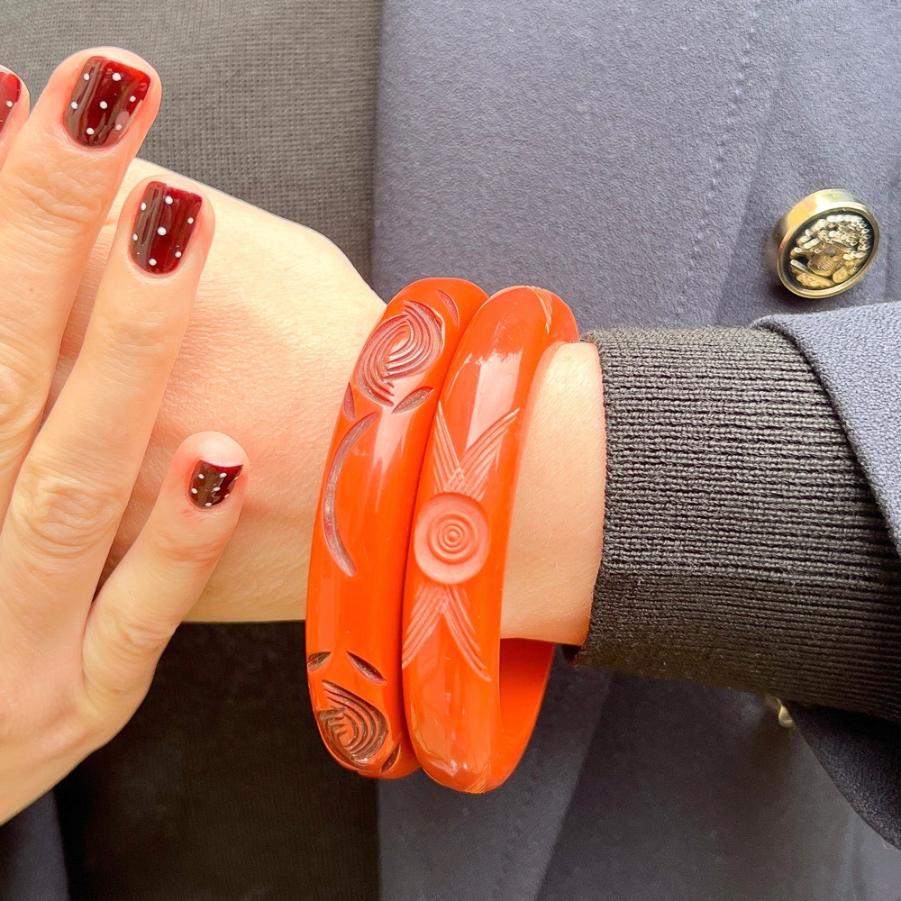 Art Deco 1930s Pair of Vintage Orange Carved Celluloid Bangles